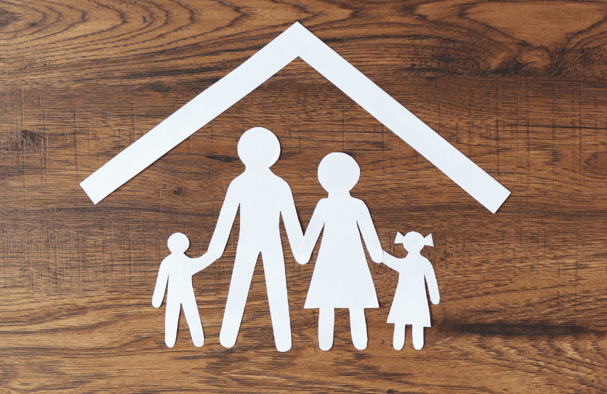 Paper family on wood background