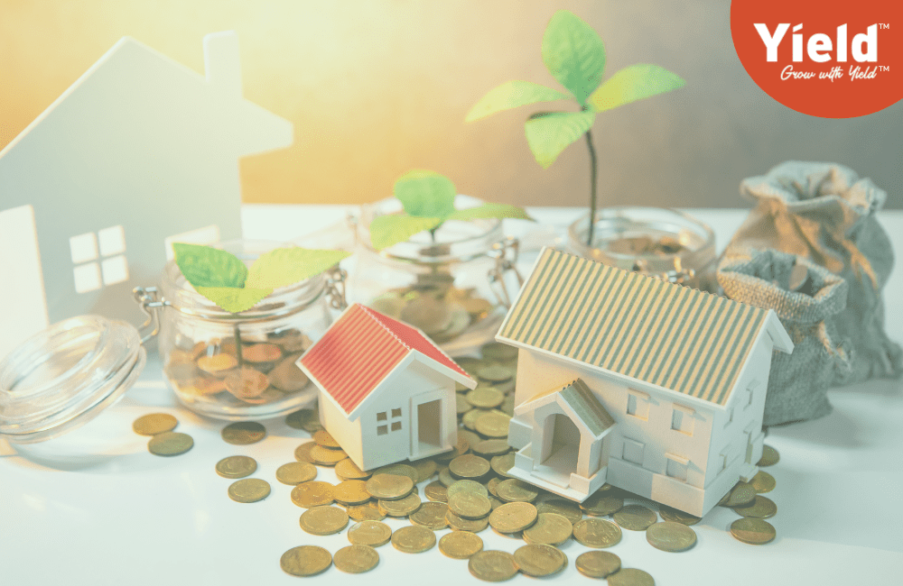 Miniature houses surrounded by coins and flourishing green plants, symbolising wealth growth. Yield Financial Planning logo in the top left corner. Illustrates estate planning for a secure retirement and comfortable aged care lifestyle